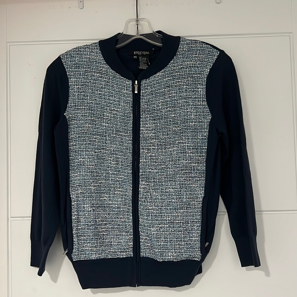 Etcetera zip up sweater with pockets.